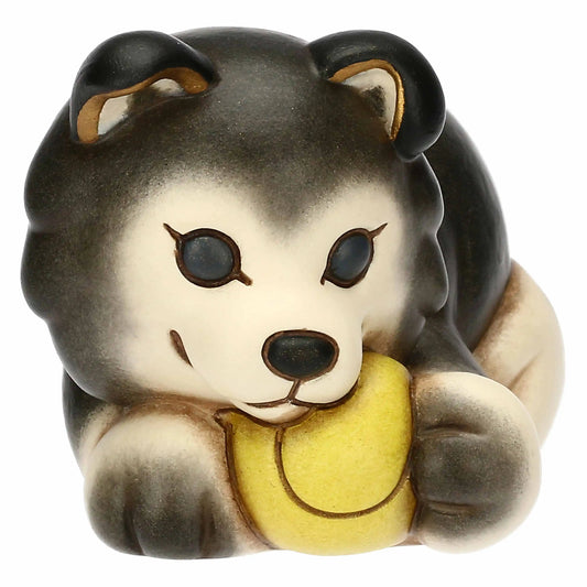 Handbemalte Husky Figur Polo aus Thun Keramik mit Kugel zwischen den Pfoten