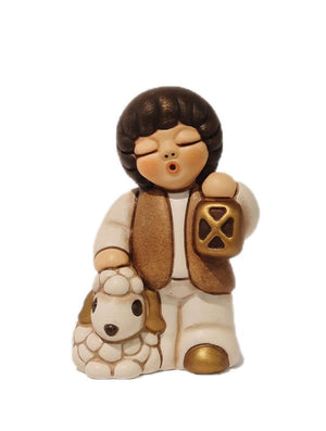 Thun Krippenfigur Kind mit Schaf und Laterne Ein leuchtender Moment voller Frieden und Hoffnung