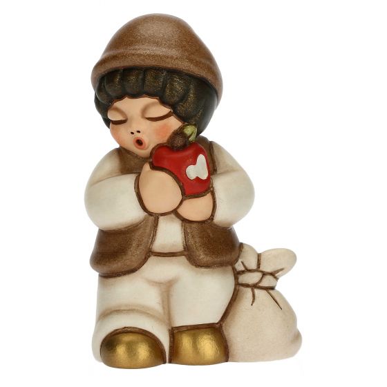 Krippenfigur Kind mit Apfel zur klassischen Krippe von Thun in champagner